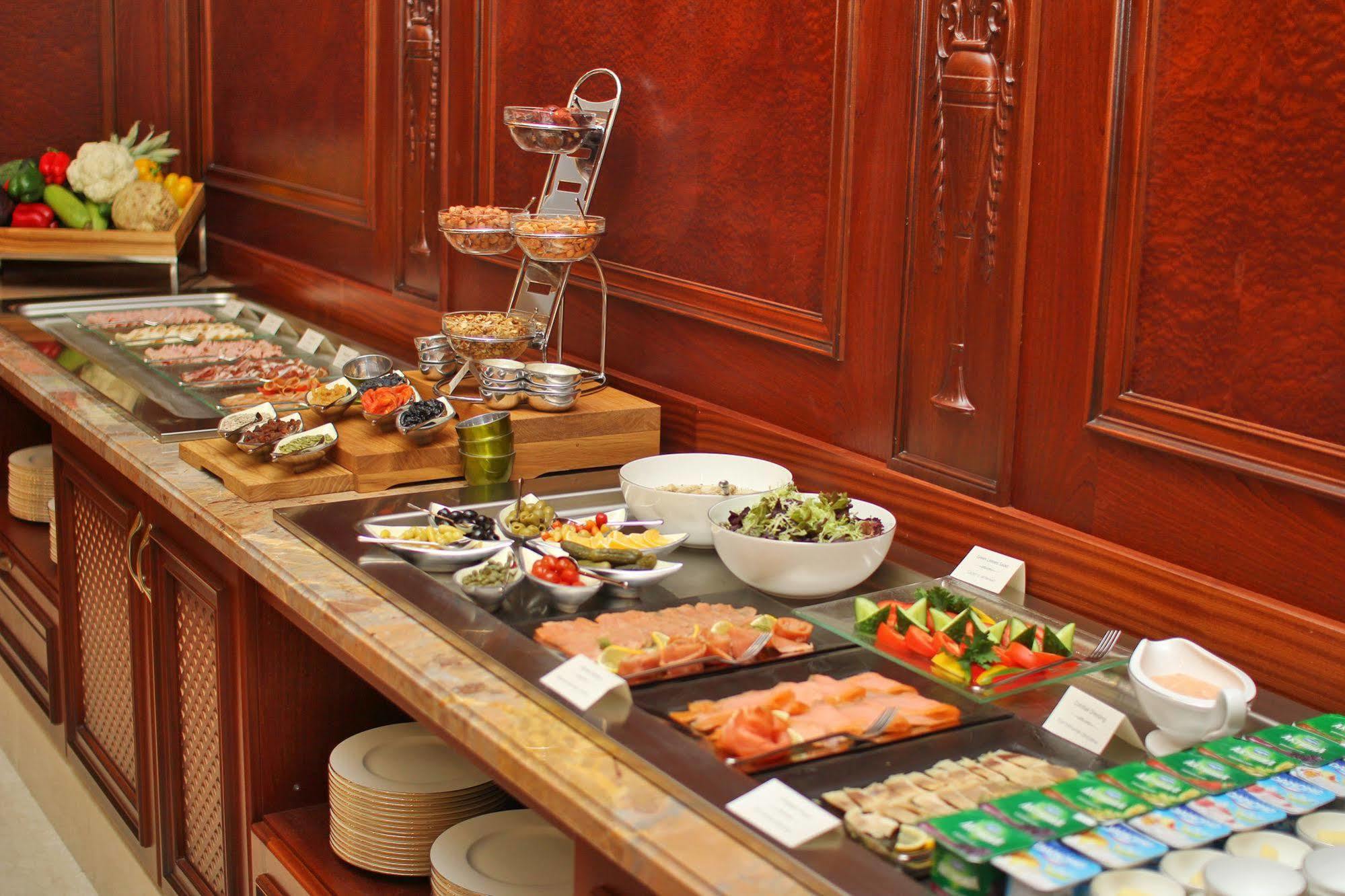 Orion Hotel Bishkek Exterior foto A buffet at a hotel